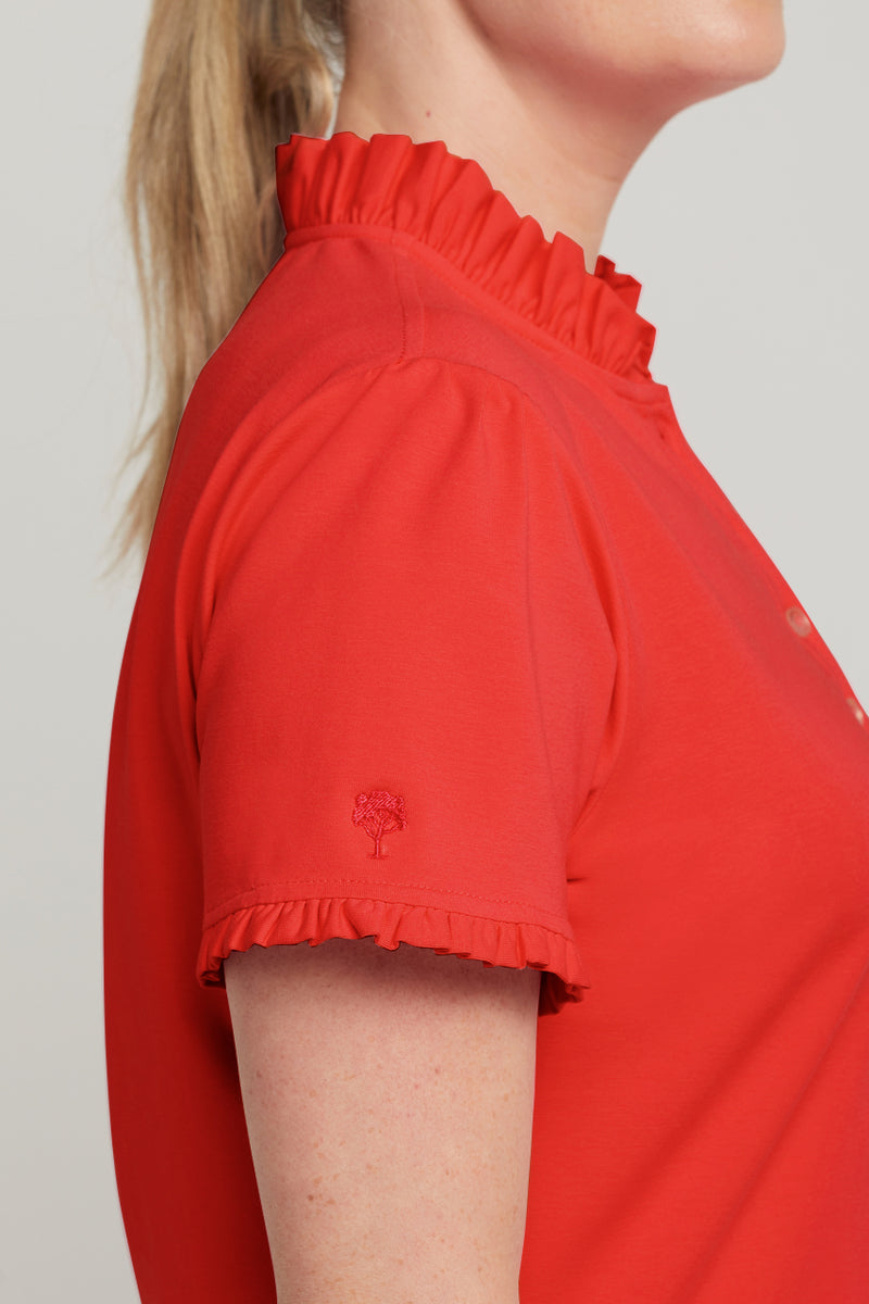 Ladies red ruffled collar golf top